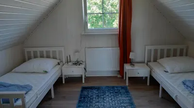 Ein Bett oder Betten in einem Zimmer der Unterkunft Ferienhaus Lotte