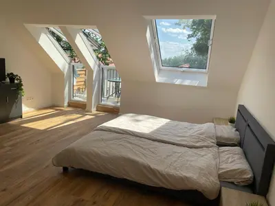 Ein Bett oder Betten in einem Zimmer der Unterkunft Gästehaus Hoppegarten