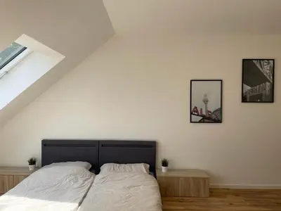 Ein Bett oder Betten in einem Zimmer der Unterkunft Gästehaus Hoppegarten