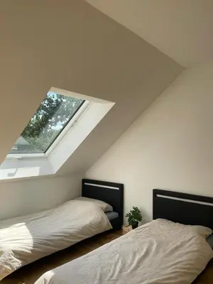 Ein Bett oder Betten in einem Zimmer der Unterkunft Gästehaus Hoppegarten