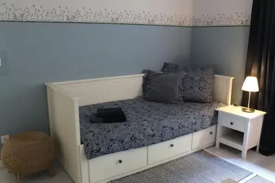 Ein Bett oder Betten in einem Zimmer der Unterkunft Moderne Wohnung im skandinavischen Stil am Waldrand