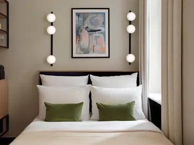 Ein Bett oder Betten in einem Zimmer der Unterkunft Numa Berlin Novela