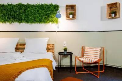 Ein Bett oder Betten in einem Zimmer der Unterkunft Hotel Alex Berlin
