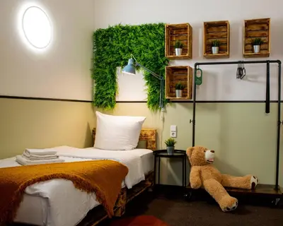 Ein Bett oder Betten in einem Zimmer der Unterkunft Hotel Alex Berlin