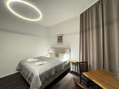 Ein Bett oder Betten in einem Zimmer der Unterkunft Hotel Bregenz