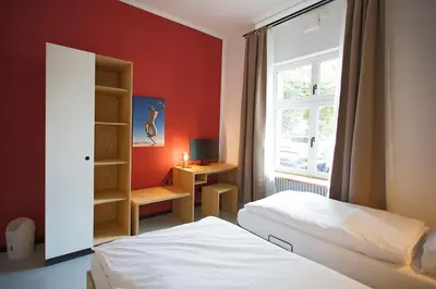 Ein Bett oder Betten in einem Zimmer der Unterkunft Schillinger-Berlin am Tempelhofer Feld
