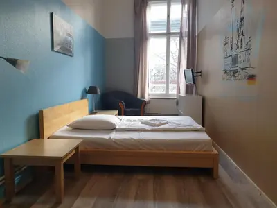 Ein Bett oder Betten in einem Zimmer der Unterkunft Pension I