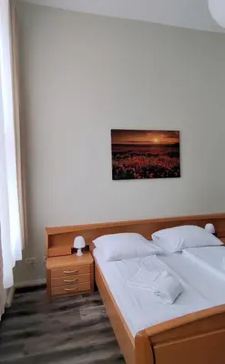 Ein Bett oder Betten in einem Zimmer der Unterkunft Pension I