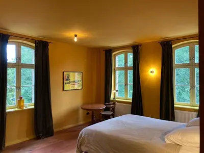 Ein Bett oder Betten in einem Zimmer der Unterkunft An Den Wiesen Gasthaus am Finowkanal