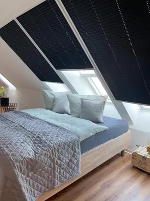 Ein Bett oder Betten in einem Zimmer der Unterkunft Ferienwohnung Kamrath mit wunderschönem Ausblick