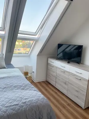 Ein Bett oder Betten in einem Zimmer der Unterkunft Ferienwohnung Kamrath mit wunderschönem Ausblick