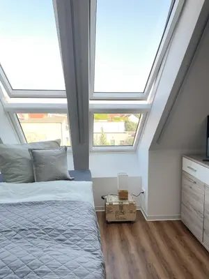 Ein Bett oder Betten in einem Zimmer der Unterkunft Ferienwohnung Kamrath mit wunderschönem Ausblick