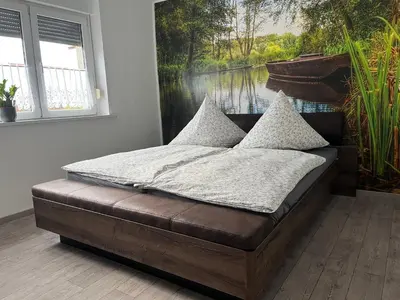 Ein Bett oder Betten in einem Zimmer der Unterkunft Kahnstübchen Mit NEUEM Innenhof Garten