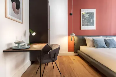 Ein Bett oder Betten in einem Zimmer der Unterkunft ipartment Berlin Kurfürstendamm