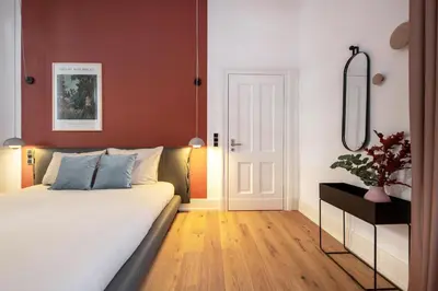 Ein Bett oder Betten in einem Zimmer der Unterkunft ipartment Berlin Kurfürstendamm