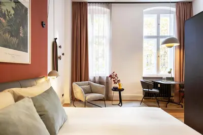 Ein Bett oder Betten in einem Zimmer der Unterkunft ipartment Berlin Kurfürstendamm