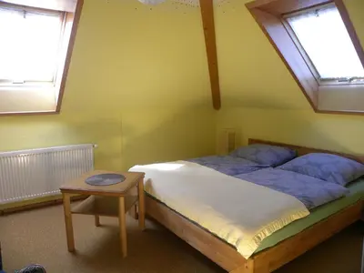 Ein Bett oder Betten in einem Zimmer der Unterkunft Ferienwohnung an der Schorfheide