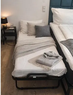 Ein Bett oder Betten in einem Zimmer der Unterkunft Pure Berlin Apartments - for up to 5 guests near Uber Arena, central, stylish