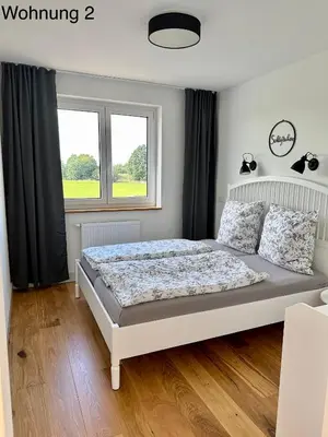 Ein Bett oder Betten in einem Zimmer der Unterkunft Ferienwohnungen Tenner