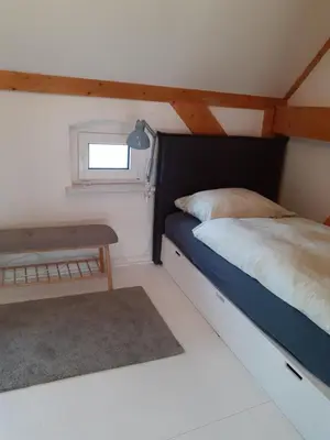 Ein Bett oder Betten in einem Zimmer der Unterkunft Ferienwohnung Martinsblick