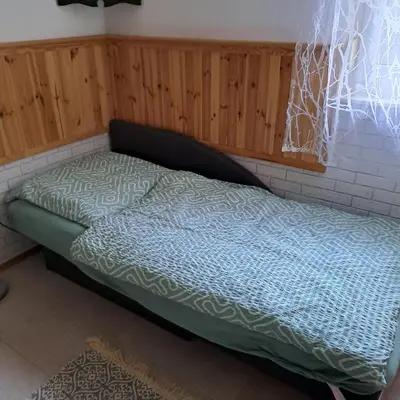 Ein Bett oder Betten in einem Zimmer der Unterkunft Häuschen am Waldrand