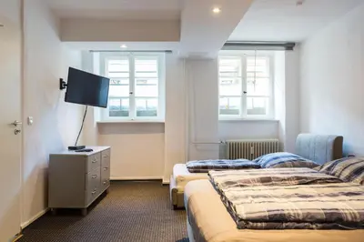 Ein Bett oder Betten in einem Zimmer der Unterkunft Bergmann Kiez. The place to be!