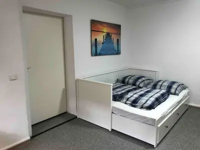 Ein Bett oder Betten in einem Zimmer der Unterkunft Bergmann Kiez. The place to be!