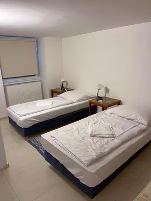 Ein Bett oder Betten in einem Zimmer der Unterkunft Pension Thomas Rooms