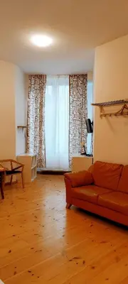 Ein Sitzbereich in der Unterkunft Pension Thomas Rooms