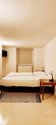 Ein Bett oder Betten in einem Zimmer der Unterkunft Pension Thomas Rooms