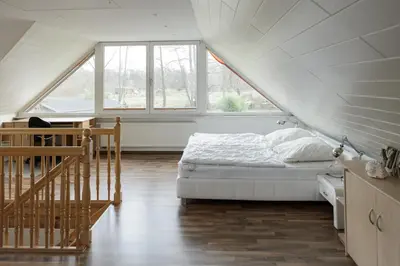 Ein Bett oder Betten in einem Zimmer der Unterkunft Ferienhaus direkt an der Spree mit Whirlpool und Sauna