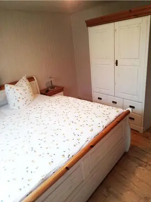 Ein Bett oder Betten in einem Zimmer der Unterkunft Spreewälder Schwalbenhof - Ferienwohnung 