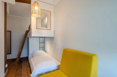 Ein Bett oder Betten in einem Zimmer der Unterkunft Marina Maisonette Seeblick mit Pool und Sauna