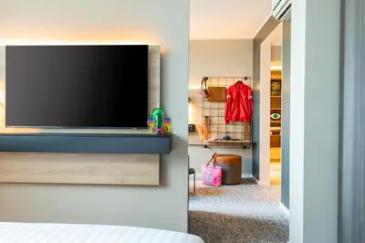 Ein Bett oder Betten in einem Zimmer der Unterkunft Moxy Berlin Airport