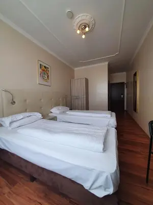 Ein Bett oder Betten in einem Zimmer der Unterkunft R&B Hotel
