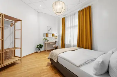 Ein Bett oder Betten in einem Zimmer der Unterkunft Holiday 33 Apartment J Prenzlauerberg