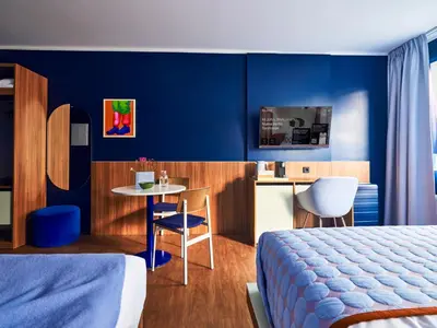 Ein Bett oder Betten in einem Zimmer der Unterkunft Numa Berlin Torstrasse