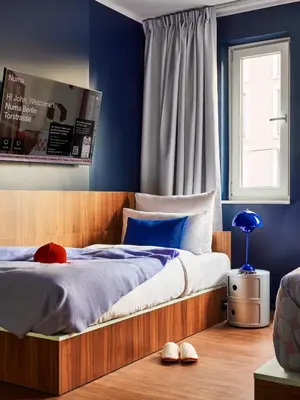 Ein Bett oder Betten in einem Zimmer der Unterkunft Numa Berlin Torstrasse