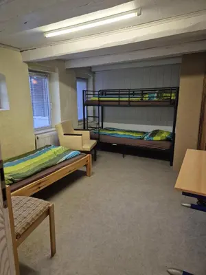 Ein Bett oder Betten in einem Zimmer der Unterkunft Montage Wohnung zum Walnussbaum Deutschhof