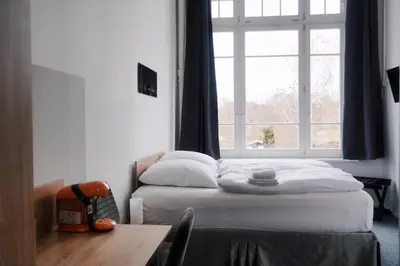 Ein Bett oder Betten in einem Zimmer der Unterkunft Motel Home Wittenau