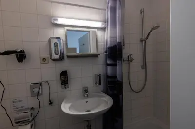 Ein Badezimmer in der Unterkunft Motel Home Wittenau