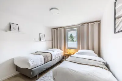 Ein Bett oder Betten in einem Zimmer der Unterkunft Ferienhaus Seeliebe 70 QM I 2 Schlafzimmer I 5 min zum See I überdachte Terrasse I nahe Werbellinsee