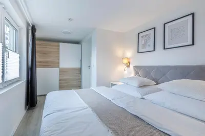 Ein Bett oder Betten in einem Zimmer der Unterkunft Ferienhaus Seeliebe 70 QM I 2 Schlafzimmer I 5 min zum See I überdachte Terrasse I nahe Werbellinsee