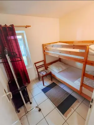 Ein Bett oder Betten in einem Zimmer der Unterkunft Ferienhäuser Heideröslein