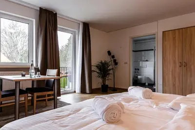 Ein Bett oder Betten in einem Zimmer der Unterkunft Motel Zur Dachsbaude