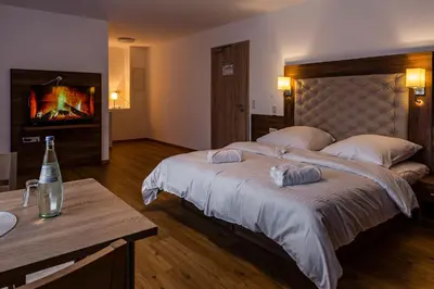 Ein Bett oder Betten in einem Zimmer der Unterkunft Motel Zur Dachsbaude