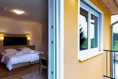 Ein Bett oder Betten in einem Zimmer der Unterkunft Motel Zur Dachsbaude