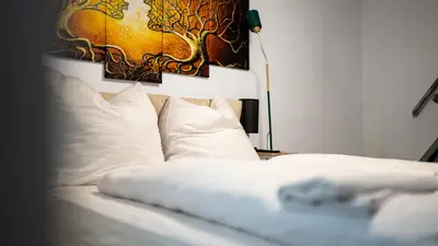 Ein Bett oder Betten in einem Zimmer der Unterkunft Boxi Jungle House - unique in Friedrichshain - 3BR
