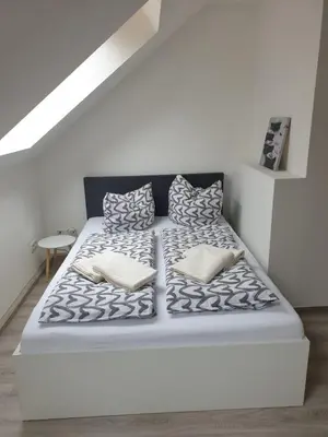 Ein Bett oder Betten in einem Zimmer der Unterkunft Ferienwohnung 6 - Gourmetzimmer