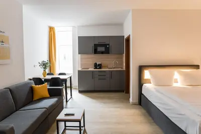 Ein Bett oder Betten in einem Zimmer der Unterkunft Homaris Boxi Studios